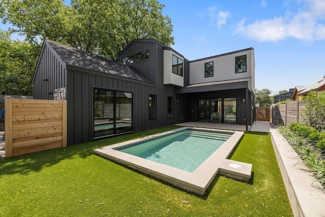 2106 Thornton Rd, Austin, TX 78704 - rear view of house featuring board and batten siding