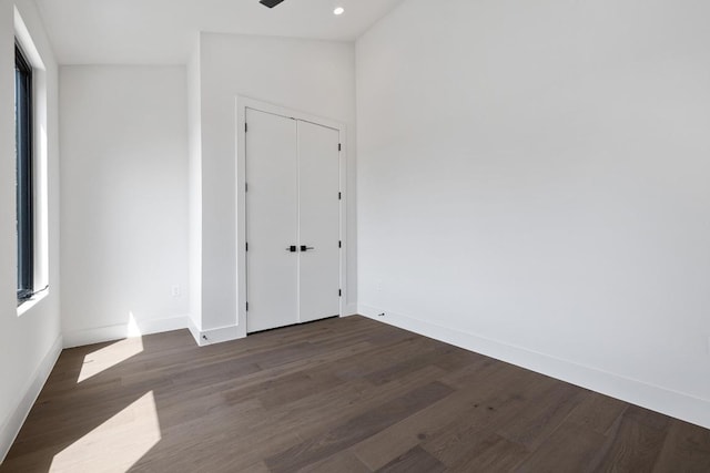 2106 Thornton Rd, Austin, TX 78704 - unfurnished bedroom with wood finished floors, baseboards, recessed lighting, and a closet