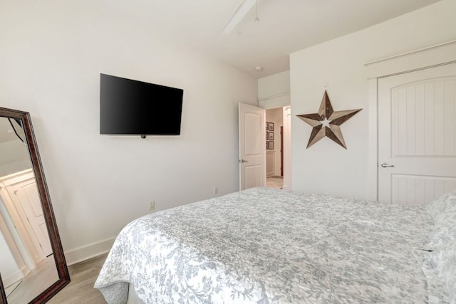 6712 Lantern View Dr Unit 303, Jonestown, TX 78645 - bedroom featuring wood finished floors and baseboards