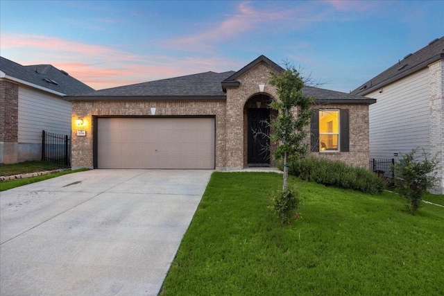 7008 Daniel Ranch Dr, Austin, TX 78744 - view of front of home with brick siding, a garage, and concrete driveway