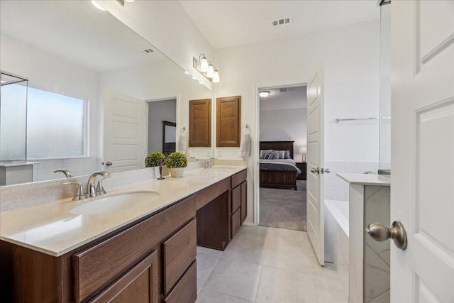 7008 Daniel Ranch Dr, Austin, TX 78744 - full bath featuring double vanity, tile patterned flooring, ensuite bathroom, and a bath