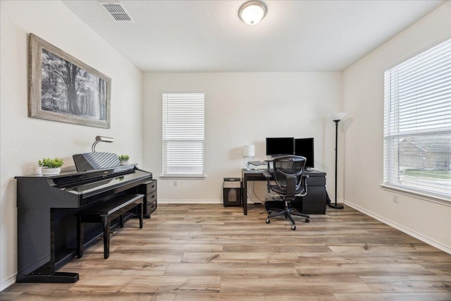 7008 Daniel Ranch Dr, Austin, TX 78744 - office space featuring light wood-type flooring and baseboards