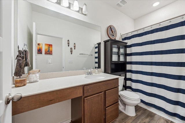7008 Daniel Ranch Dr, Austin, TX 78744 - bathroom with vanity, wood finished floors, and a shower with curtain