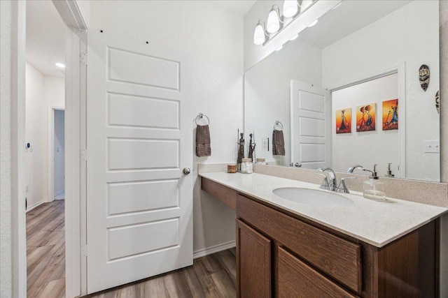 7008 Daniel Ranch Dr, Austin, TX 78744 - bathroom with wood finished floors and vanity