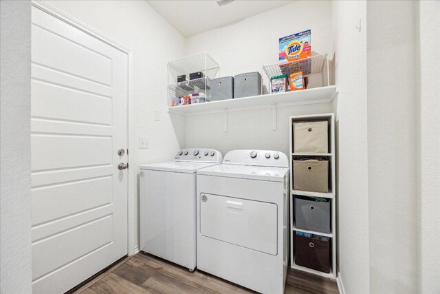 7008 Daniel Ranch Dr, Austin, TX 78744 - washroom featuring washer and clothes dryer and dark wood finished floors