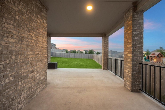 7008 Daniel Ranch Dr, Austin, TX 78744 - patio terrace at dusk featuring a patio and cooling unit