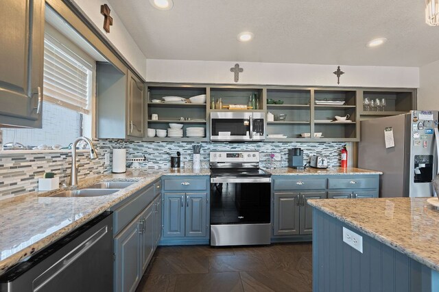 156 Lakefront Dr, Point Venture, TX 78645 - kitchen with appliances with stainless steel finishes, open shelves, a sink, backsplash, and recessed lighting