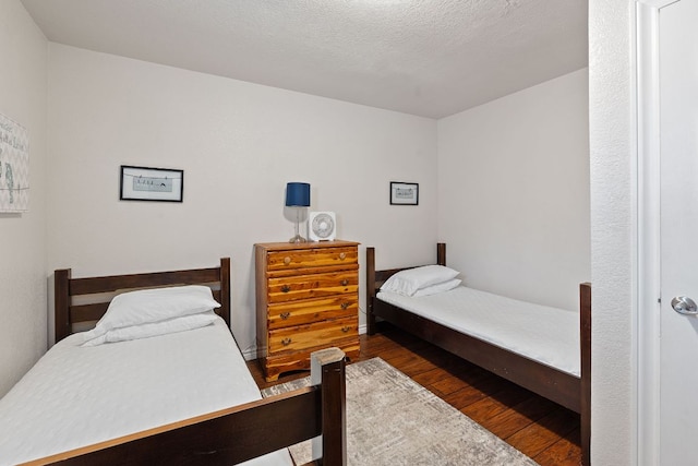156 Lakefront Dr, Point Venture, TX 78645 - bedroom with wood finished floors