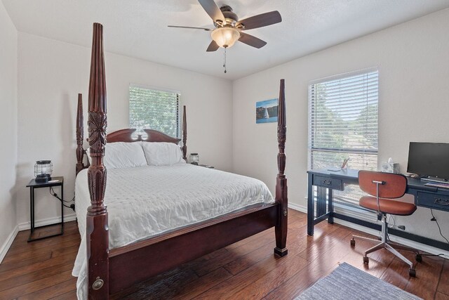 156 Lakefront Dr, Point Venture, TX 78645 - bedroom featuring hardwood / wood-style flooring, baseboards, a ceiling fan, and a desk