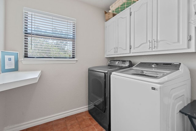 156 Lakefront Dr, Point Venture, TX 78645 - washroom with independent washer and dryer, baseboards, cabinet space, and tile patterned flooring