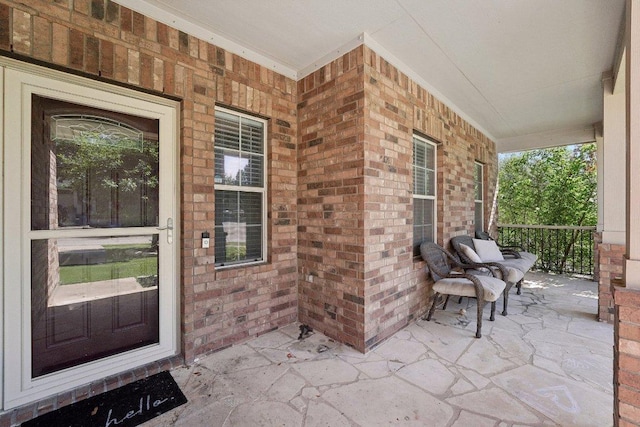 504 Chaparral Dr, Leander, TX 78641 - property entrance with covered porch and brick siding