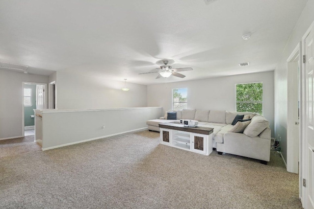 504 Chaparral Dr, Leander, TX 78641 - living room featuring a ceiling fan, carpet floors, and baseboards