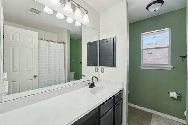 504 Chaparral Dr, Leander, TX 78641 - bathroom featuring toilet, baseboards, vanity, tile patterned flooring, and curtained shower