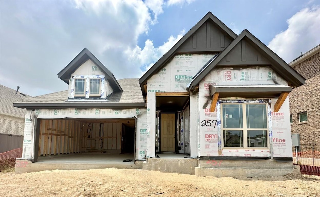 257 Du Bois Ln, Kyle, TX 78640 - unfinished property featuring roof with shingles