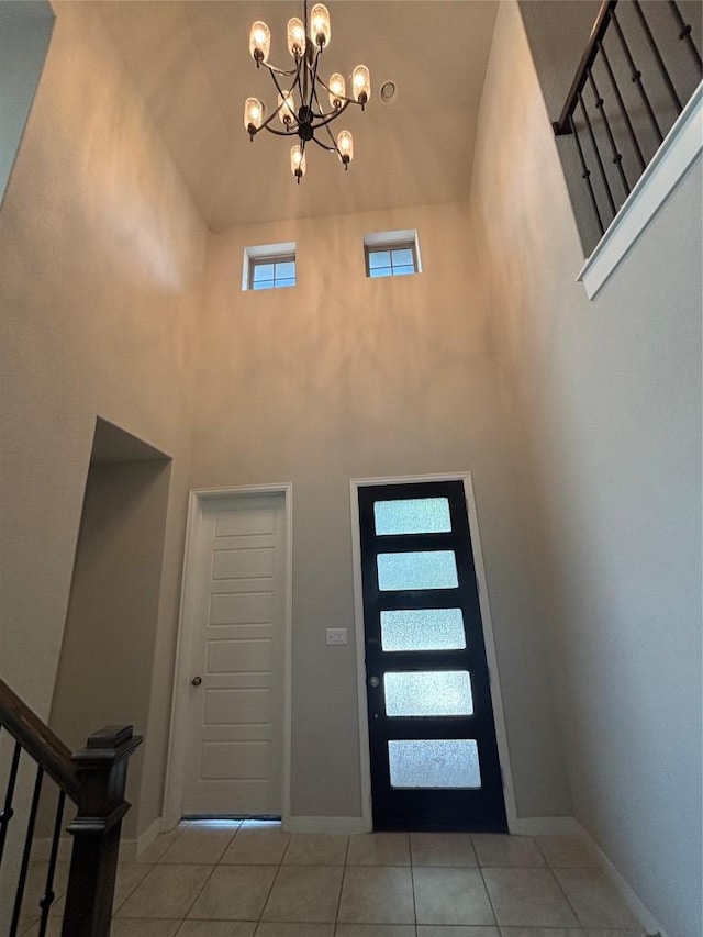 2017PALMERARIDGEBLVD, 2017 Palmera Ridge Blvd, Leander, TX 78641 - entryway featuring a high ceiling, stairway, tile patterned flooring, and a chandelier
