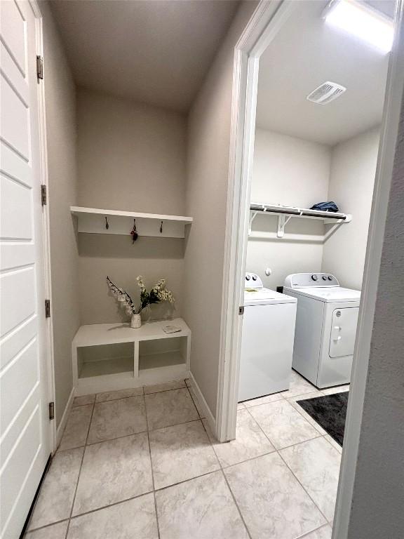 2017PALMERARIDGEBLVD, 2017 Palmera Ridge Blvd, Leander, TX 78641 - laundry area with separate washer and dryer and light tile patterned floors