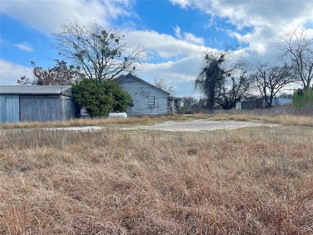 333 Spring Valley St, Hutto, TX 78634 - view of yard with an outbuilding and a pole building