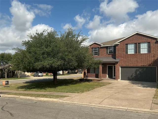 117 Waterloo Dr, Kyle, TX 78640 - view of front of property featuring an attached garage, brick siding, concrete driveway, and a front yard