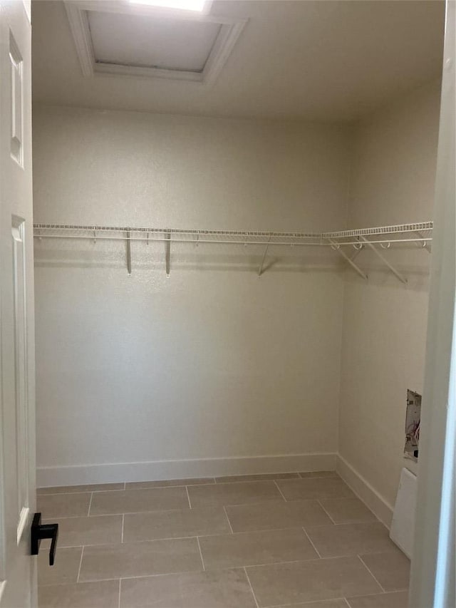 117 Waterloo Dr, Kyle, TX 78640 - walk in closet featuring attic access and light tile patterned floors