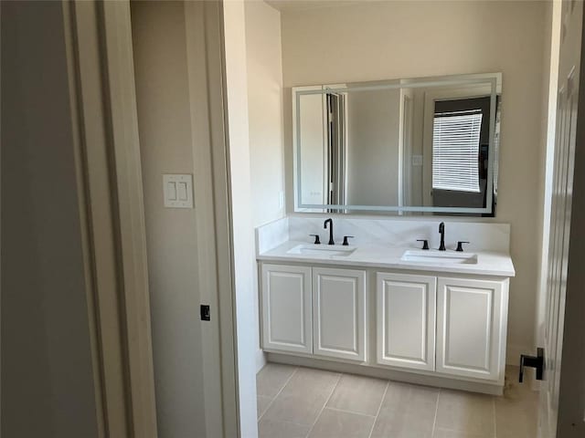 117 Waterloo Dr, Kyle, TX 78640 - bathroom featuring double vanity and tile patterned floors