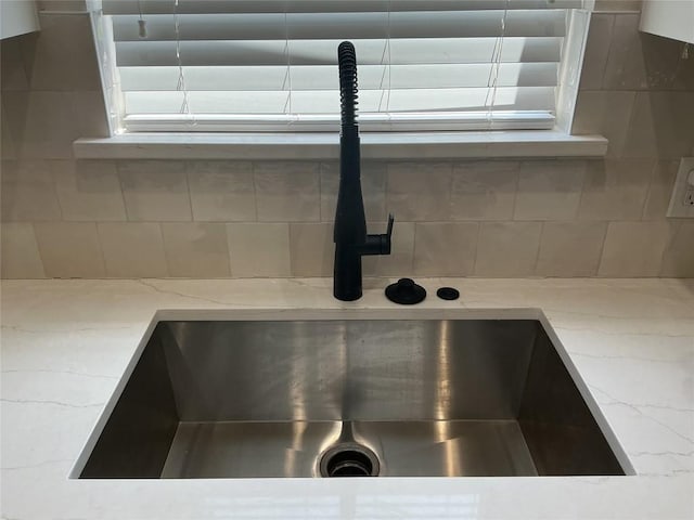 117 Waterloo Dr, Kyle, TX 78640 - kitchen view of light stone counters and tasteful backsplash