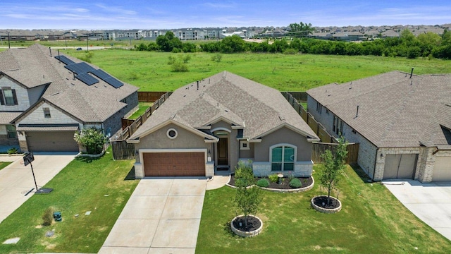 3328 Balboa Way, Round Rock, TX 78665 - view of front facade featuring driveway, stucco siding, stone siding, and a front yard