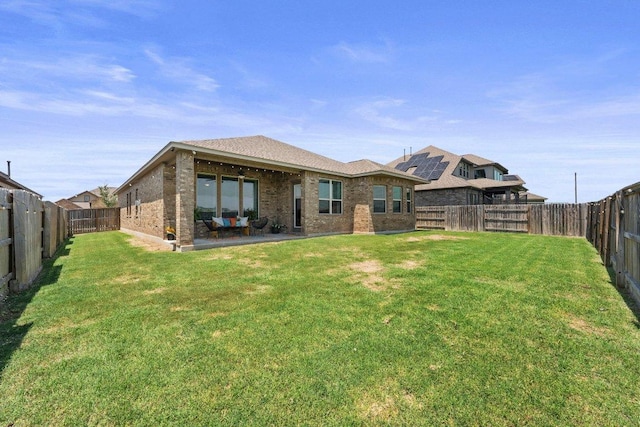 3328 Balboa Way, Round Rock, TX 78665 - rear view of house with a fenced backyard, brick siding, and a patio