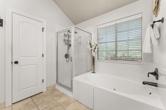 202 Dunkeld Dr, Spicewood, TX 78669 - bathroom featuring a stall shower, a garden tub, tile patterned floors, and vaulted ceiling