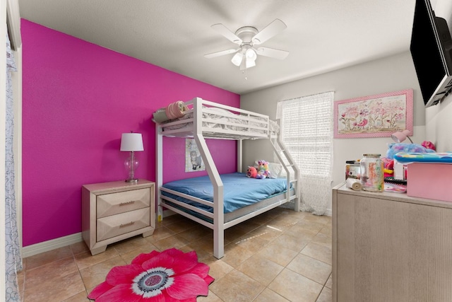 202 Dunkeld Dr, Spicewood, TX 78669 - tiled bedroom featuring a ceiling fan