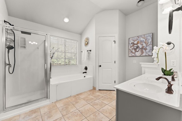 202 Dunkeld Dr, Spicewood, TX 78669 - full bath with a stall shower, a garden tub, vaulted ceiling, double vanity, and tile patterned floors