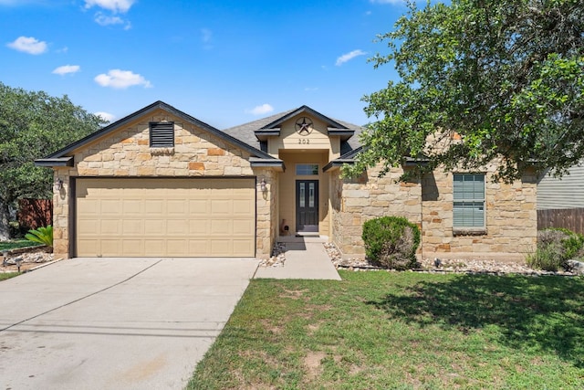 202 Dunkeld Dr, Spicewood, TX 78669 - view of front of house with stone siding, a garage, and concrete driveway