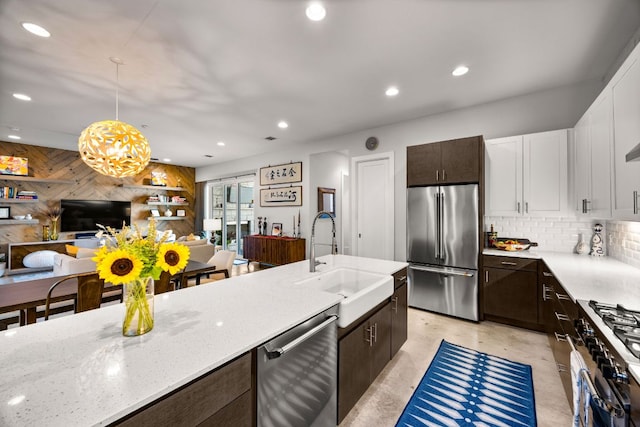 2100 E 10th St, Austin, TX 78702 - kitchen featuring high end appliances, a sink, dark brown cabinets, finished concrete flooring, and recessed lighting