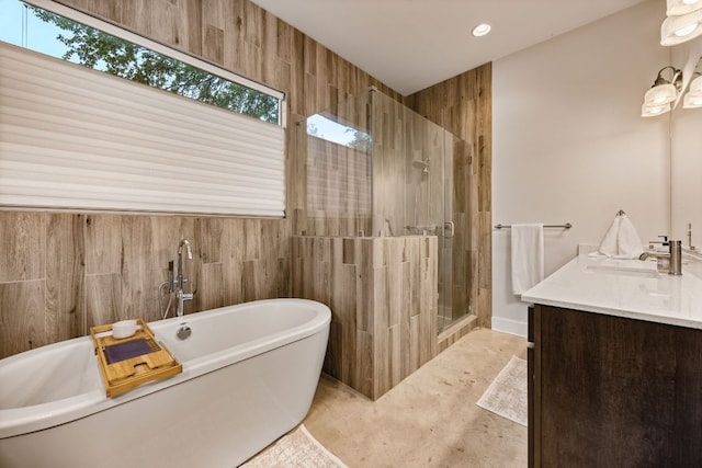2100 E 10th St, Austin, TX 78702 - bathroom with a shower stall, vanity, a soaking tub, and recessed lighting