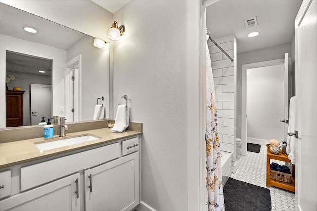 2100 E 10th St, Austin, TX 78702 - full bath with vanity, recessed lighting, shower / tub combo with curtain, and tile patterned floors