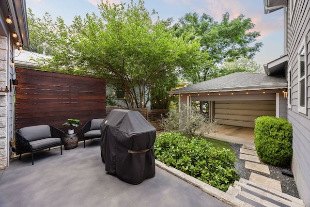 2100 E 10th St, Austin, TX 78702 - patio terrace at dusk featuring a patio area and a grill