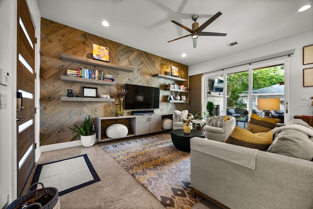 2100 E 10th St, Austin, TX 78702 - living area featuring wood walls, a ceiling fan, and recessed lighting