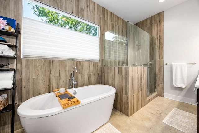 2100 E 10th St, Austin, TX 78702 - bathroom with a freestanding tub, a shower stall, and recessed lighting