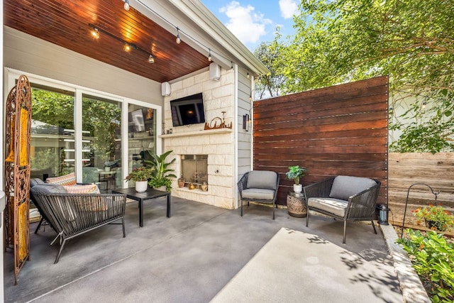 2100 E 10th St, Austin, TX 78702 - view of patio featuring an outdoor stone fireplace