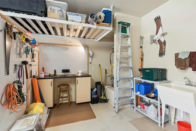 218 Duck Creek Ln, Georgetown, TX 78633 - misc room featuring a workshop area, carpet flooring, and a sink