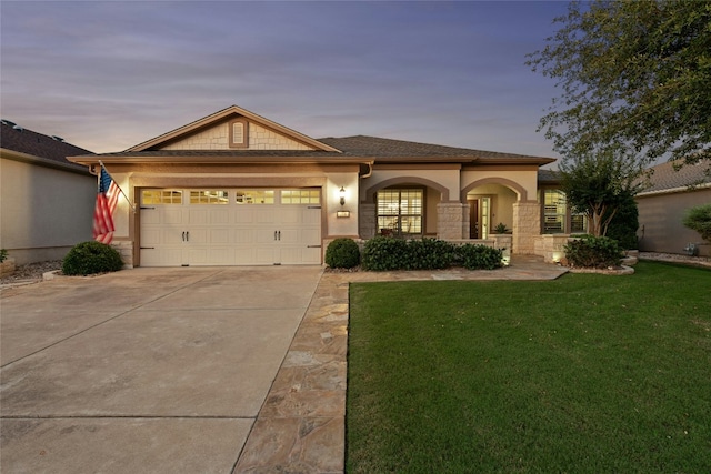 218 Duck Creek Ln, Georgetown, TX 78633 - view of front facade with a front lawn, concrete driveway, stucco siding, an attached garage, and stone siding