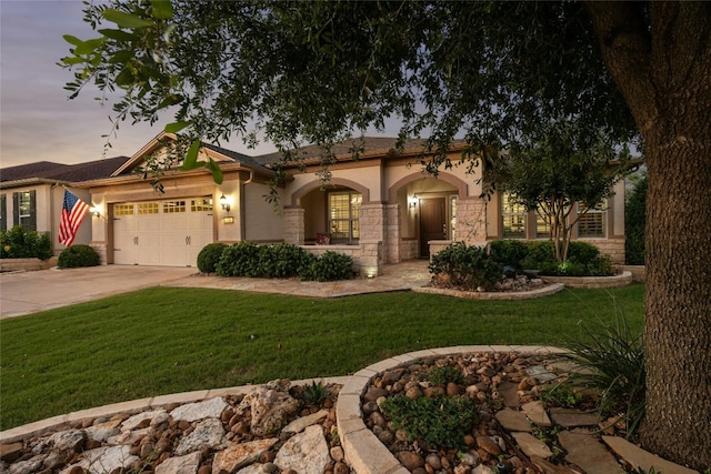 218 Duck Creek Ln, Georgetown, TX 78633 - view of front of house featuring stucco siding, a garage, a front yard, and concrete driveway