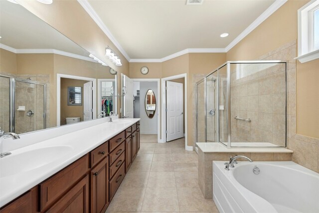 218 Duck Creek Ln, Georgetown, TX 78633 - full bath featuring double vanity, a stall shower, a garden tub, toilet, and tile patterned flooring