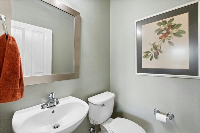 218 Duck Creek Ln, Georgetown, TX 78633 - half bathroom featuring a sink and toilet