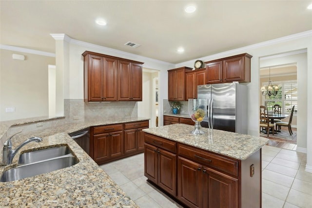 218 Duck Creek Ln, Georgetown, TX 78633 - kitchen with stainless steel appliances, a sink, backsplash, light tile patterned flooring, and crown molding