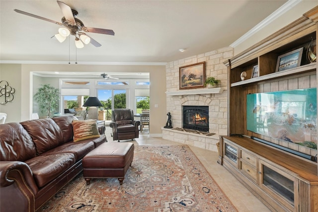 218 Duck Creek Ln, Georgetown, TX 78633 - living room featuring a ceiling fan, crown molding, a fireplace, and light tile patterned floors