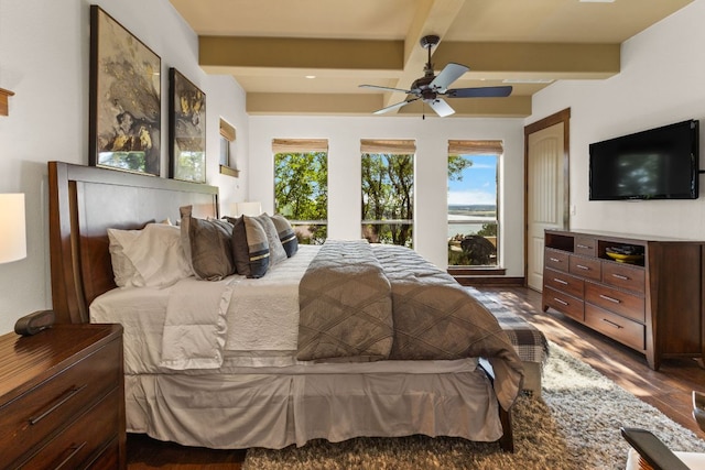 2804 Lohmans Ford Rd Unit B, Lago Vista, TX 78645 - bedroom featuring dark wood finished floors, beam ceiling, and a ceiling fan