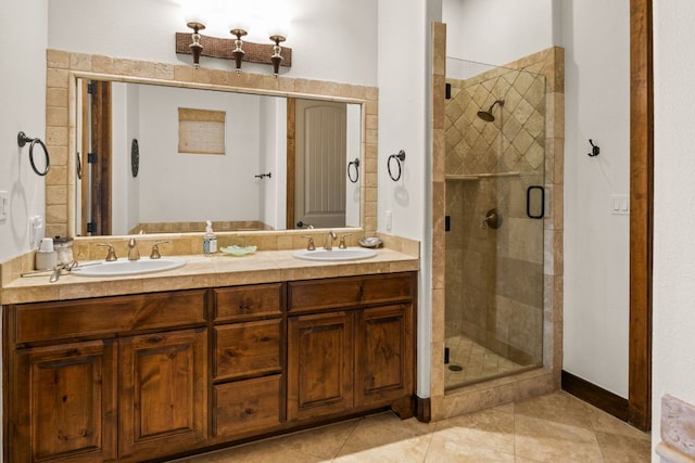2804 Lohmans Ford Rd Unit B, Lago Vista, TX 78645 - bathroom featuring a shower stall, double vanity, and tile patterned flooring