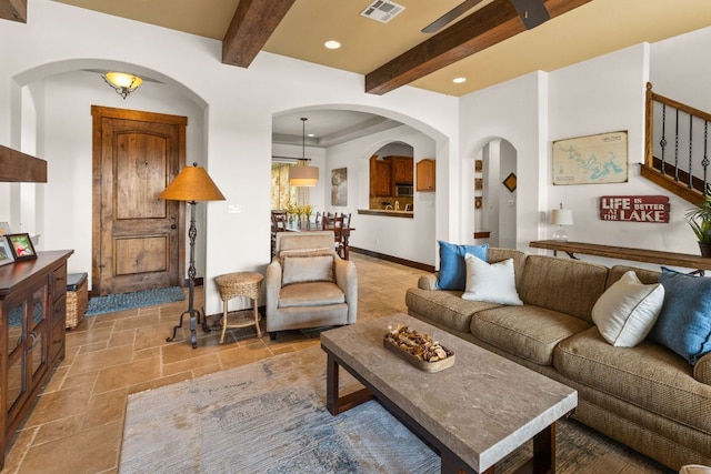 2804 Lohmans Ford Rd Unit B, Lago Vista, TX 78645 - living area with stone tile flooring, beam ceiling, recessed lighting, stairs, and arched walkways