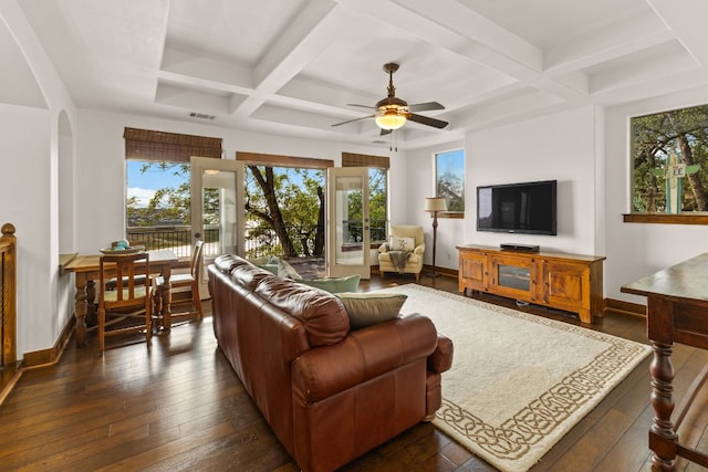 2804 Lohmans Ford Rd Unit B, Lago Vista, TX 78645 - living area with coffered ceiling, a ceiling fan, dark wood finished floors, beamed ceiling, and arched walkways