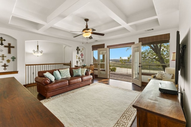 2804 Lohmans Ford Rd Unit B, Lago Vista, TX 78645 - living room featuring coffered ceiling, a ceiling fan, dark wood-style floors, beamed ceiling, and arched walkways
